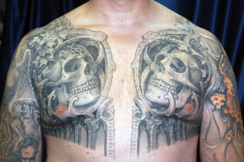 Grey Ink Twin Skulls Optical Illusion Tattoo On Chest